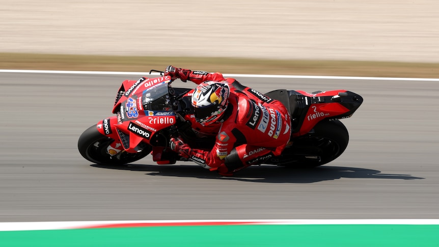 An Australian MotoGP rider takes a corner during a practice session in Spain.