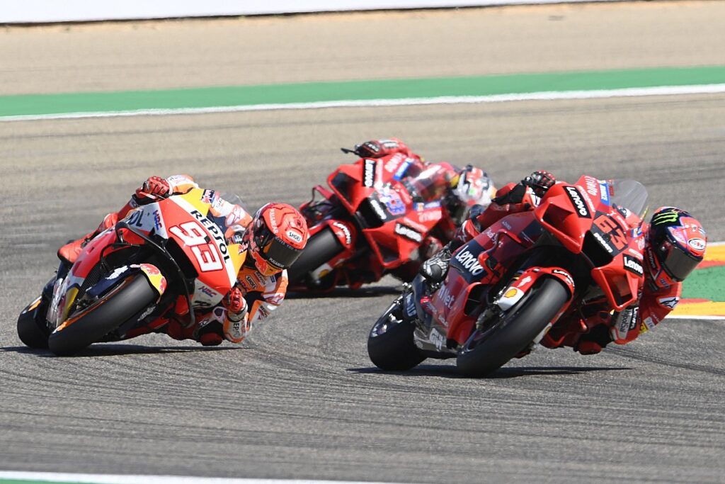 Bagnaia takes his first win after fending off Marquez in the thriller