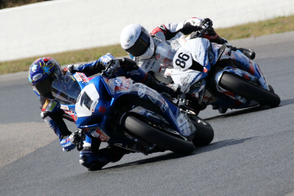 Alex Dumas (1) leads newly crowned CSBK Superbike champion Ben Young (86) in Sunday