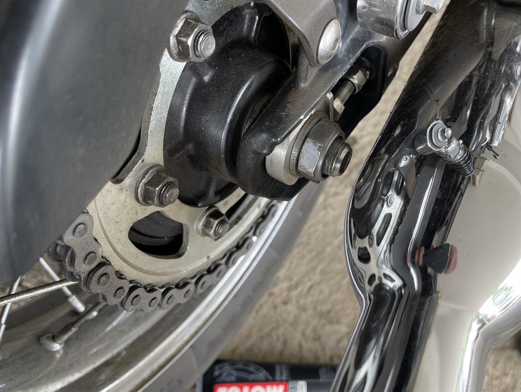 A chain tensioner on a motorcycle.